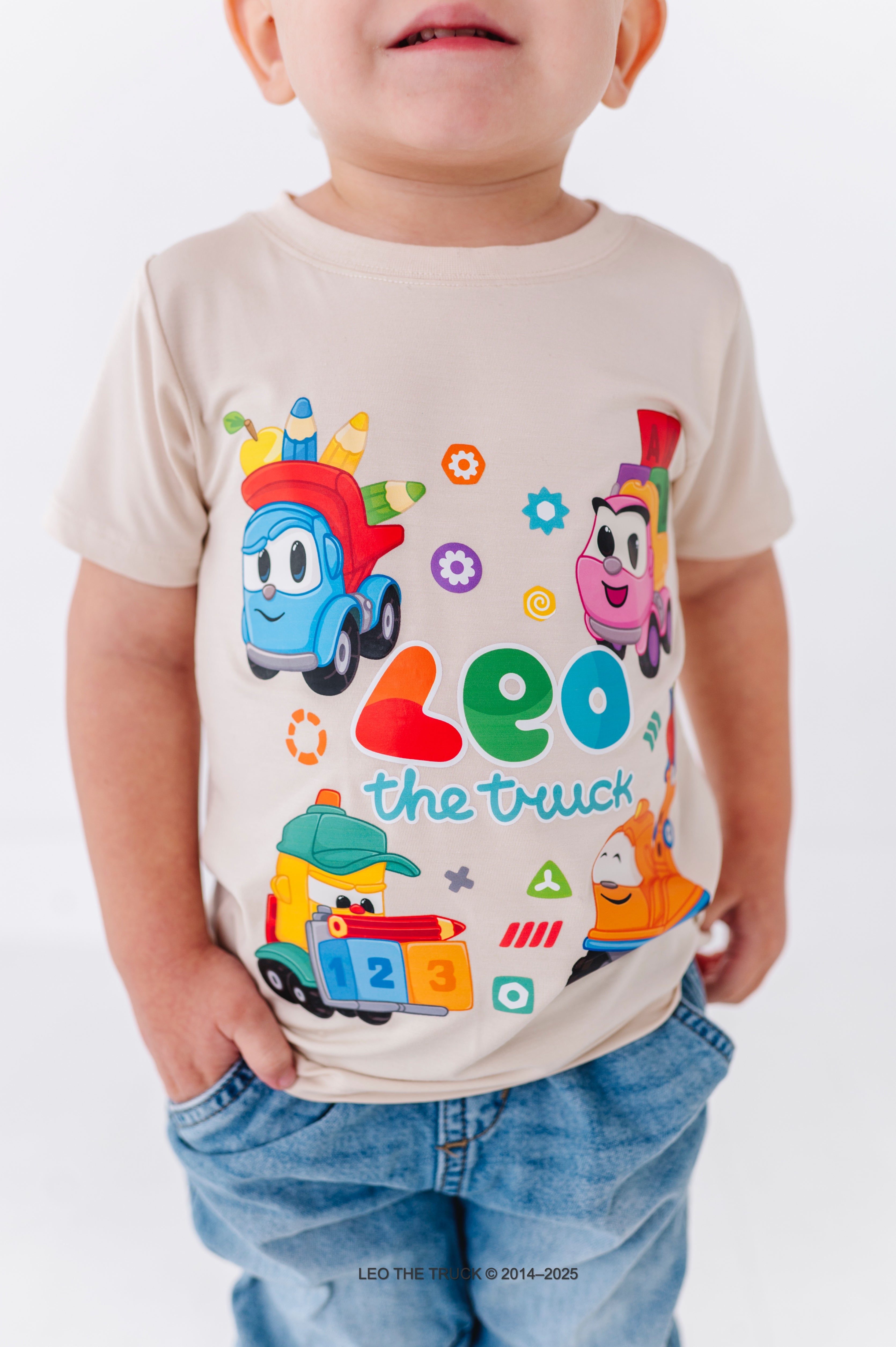 Close-up of a bamboo t-shirt with colorful Leo the Truck graphics and text on a white background